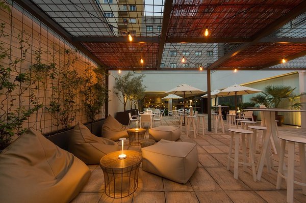 a patio with tables and chairs